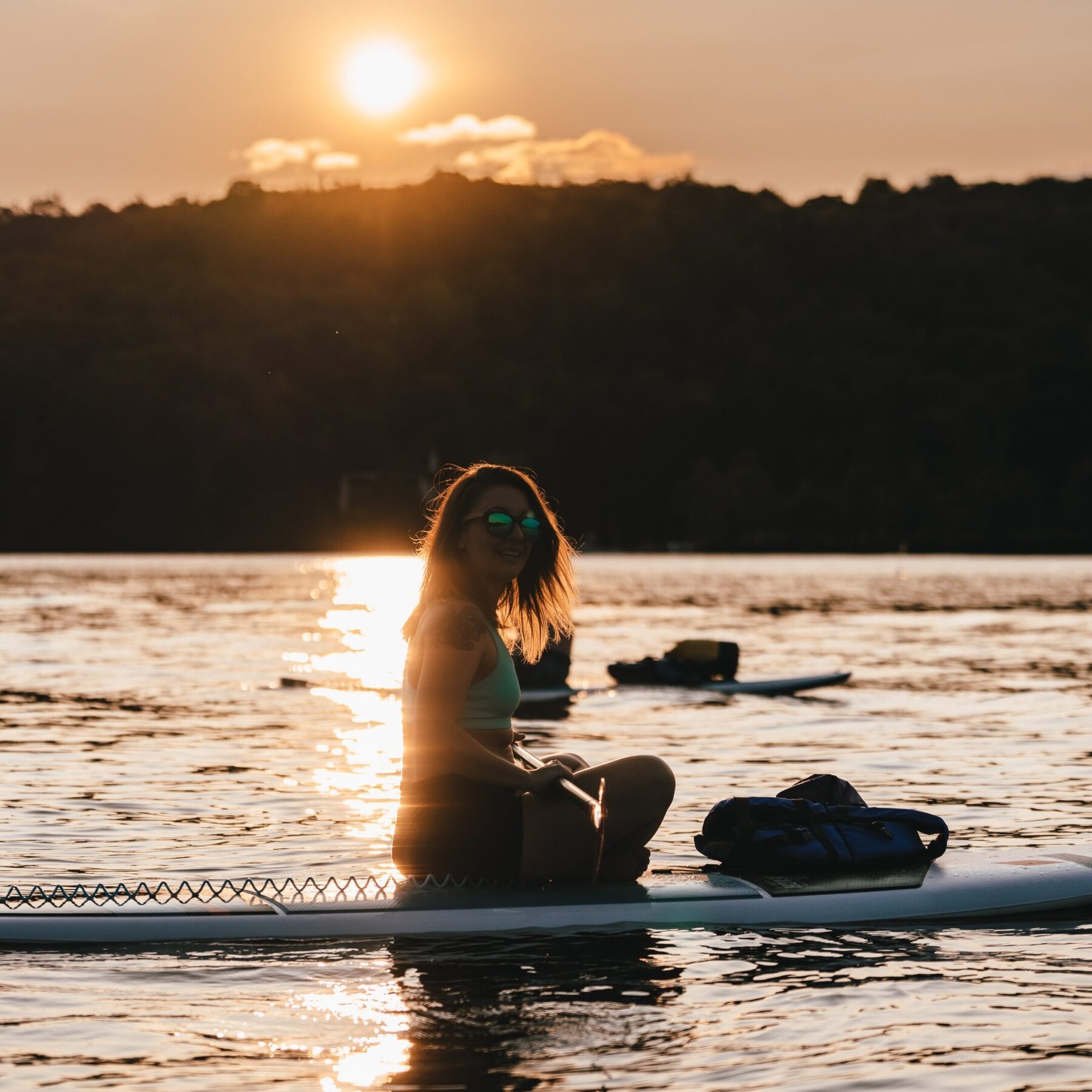 SUP yoga paddle board sunset